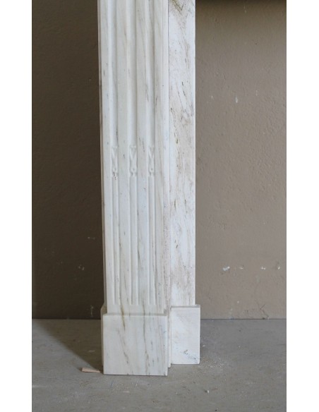 Antique Neoclassical fireplace mantel with olive branch decoration in Cremo Delicato marble, offered at a discounted price.