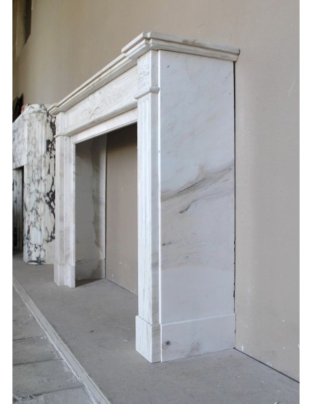 Antique Neoclassical fireplace mantel with olive branch decoration in Cremo Delicato marble, offered at a discounted price.