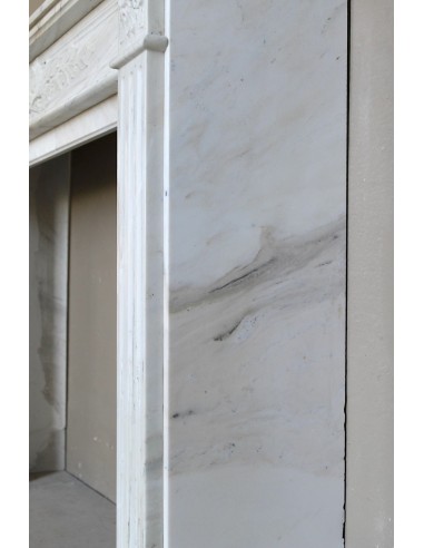Antique Neoclassical fireplace mantel with olive branch decoration in Cremo Delicato marble, offered at a discounted price.