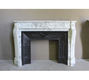Antique Neoclassical “Olive Branch” fireplace, finely carved in Arabescato white marble and with its original cast-iron insert.