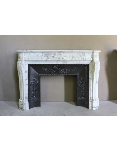 Antique Neoclassical “Olive Branch” fireplace, finely carved in Arabescato white marble and with its original cast-iron insert.