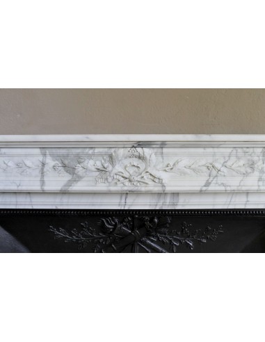 Antique Neoclassical “Olive Branch” fireplace, finely carved in Arabescato white marble and with its original cast-iron insert.