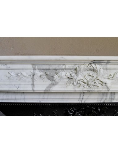 Antique Neoclassical “Olive Branch” fireplace, finely carved in Arabescato white marble and with its original cast-iron insert.