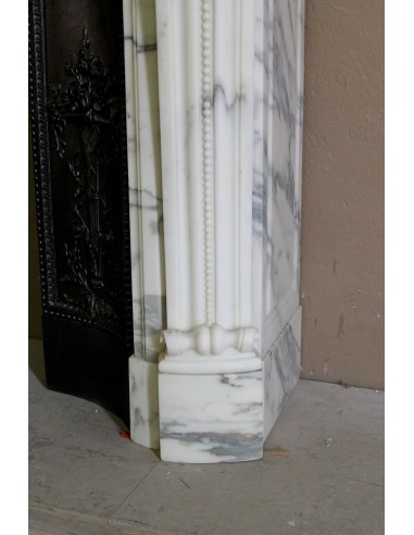 Antique Neoclassical “Olive Branch” fireplace, finely carved in Arabescato white marble and with its original cast-iron insert.