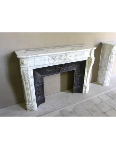 Antique Neoclassical “Olive Branch” fireplace, finely carved in Arabescato white marble and with its original cast-iron insert.