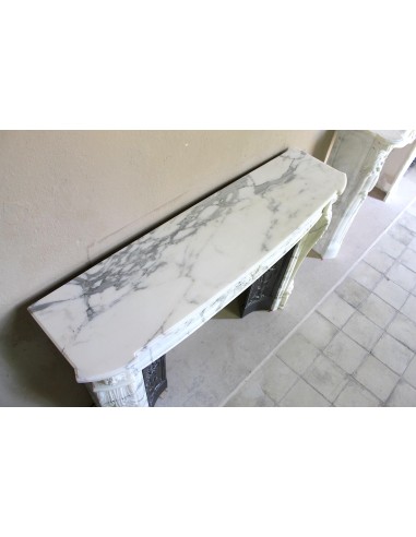 Antique Neoclassical “Olive Branch” fireplace, finely carved in Arabescato white marble and with its original cast-iron insert.