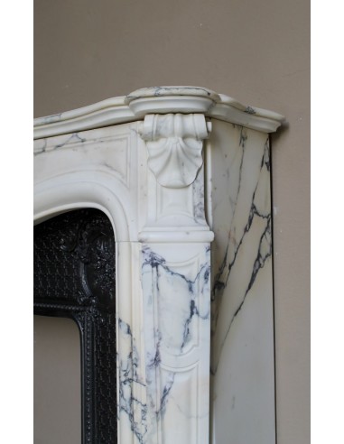 Important antique Louis XV “Coquille Bordelaise” fireplace mantel in rare Pavonazzo marble, with its original cast-iron insert.