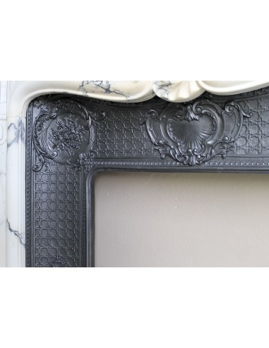 Important antique Louis XV “Coquille Bordelaise” fireplace mantel in rare Pavonazzo marble, with its original cast-iron insert.