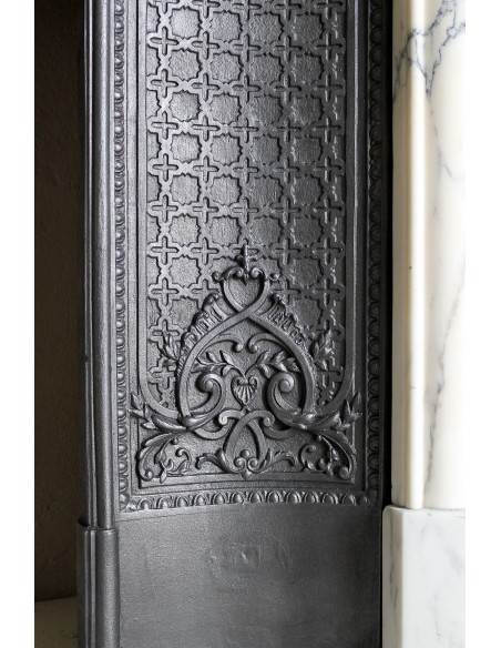 Important antique Louis XV “Coquille Bordelaise” fireplace mantel in rare Pavonazzo marble, with its original cast-iron insert.