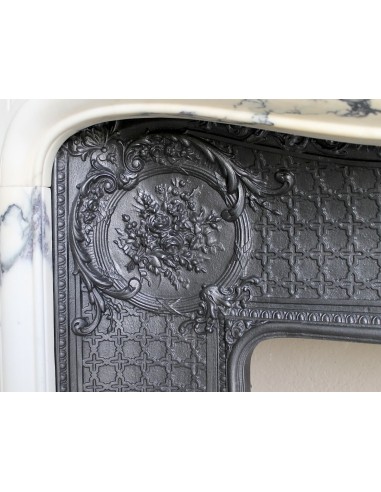 Important antique Louis XV “Coquille Bordelaise” fireplace mantel in rare Pavonazzo marble, with its original cast-iron insert.