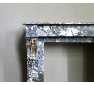 Antique “Palmettes” fireplace in a charmingly compact size, carved in Black marble with richly varied multicoloured veining. 2