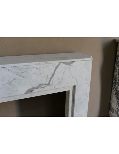 Beautiful antique Art Deco-style fireplace mantel carved in White veined Carrara marble.