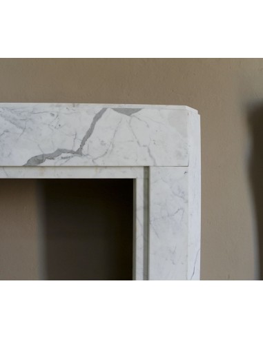 Beautiful antique Art Deco-style fireplace mantel carved in White veined Carrara marble.