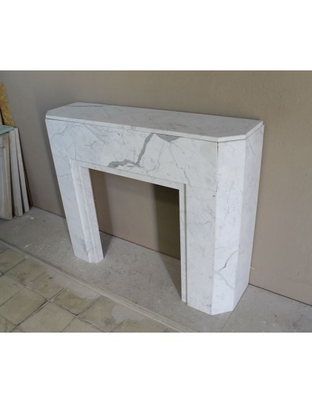 Beautiful antique Art Deco-style fireplace mantel carved in White veined Carrara marble.