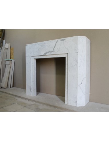 Beautiful antique Art Deco-style fireplace mantel carved in White veined Carrara marble.
