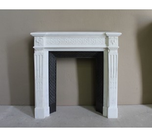 Exceptionally small and refined Neoclassical “Macaron” antique fireplace mantel in pristine Statuario white marble.