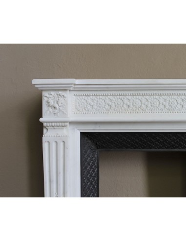 Exceptionally small and refined Neoclassical “Macaron” antique fireplace mantel in pristine Statuario white marble.