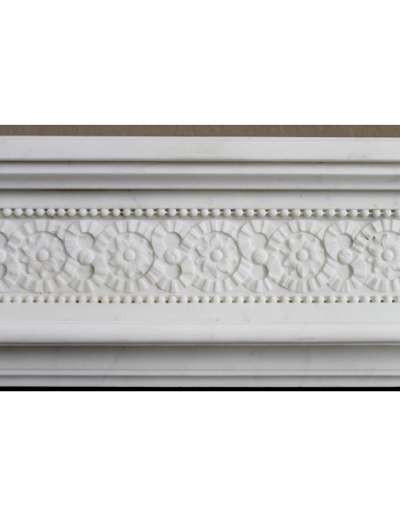 Exceptionally small and refined Neoclassical “Macaron” antique fireplace mantel in pristine Statuario white marble.