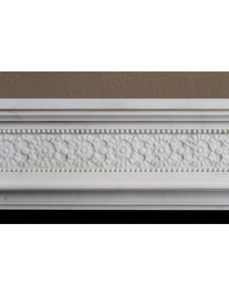 Exceptionally small and refined Neoclassical “Macaron” antique fireplace mantel in pristine Statuario white marble.