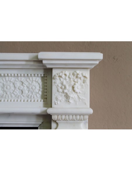 Exceptionally small and refined Neoclassical “Macaron” antique fireplace mantel in pristine Statuario white marble.