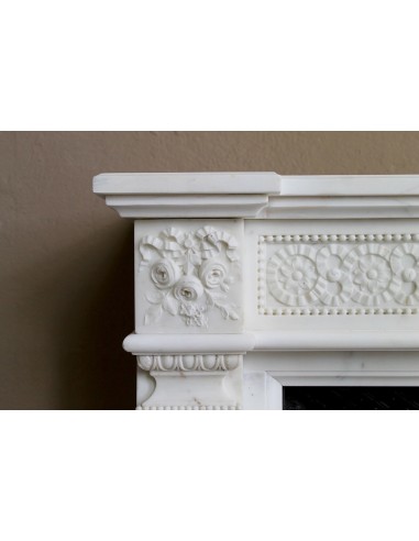 Exceptionally small and refined Neoclassical “Macaron” antique fireplace mantel in pristine Statuario white marble.