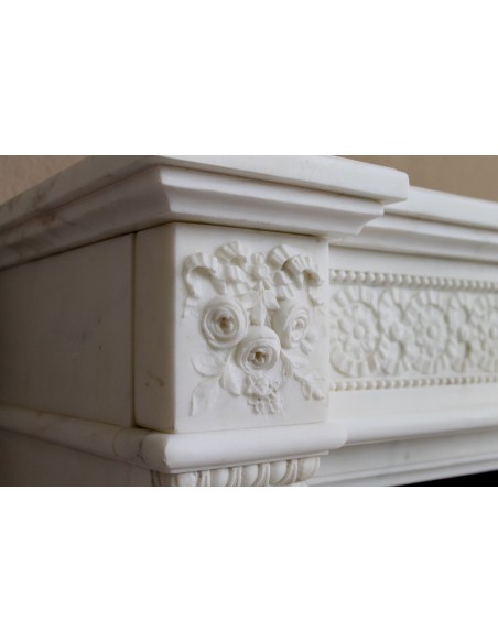 Exceptionally small and refined Neoclassical “Macaron” antique fireplace mantel in pristine Statuario white marble.