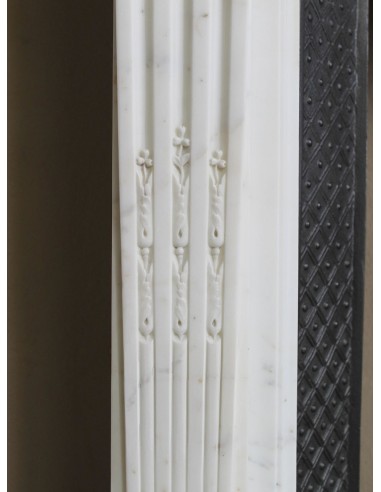 Exceptionally small and refined Neoclassical “Macaron” antique fireplace mantel in pristine Statuario white marble.
