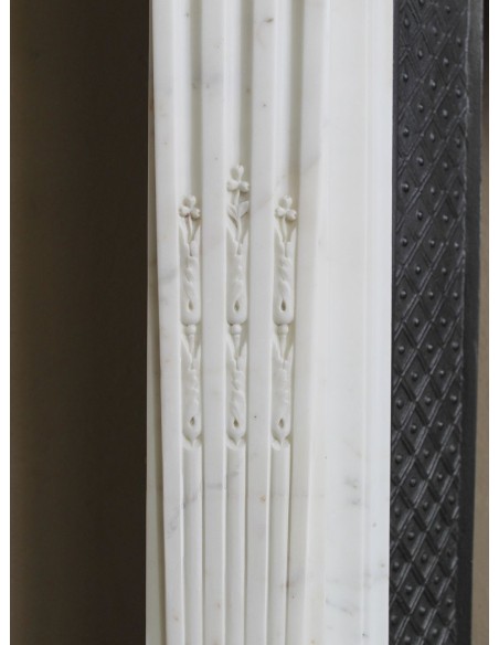 Exceptionally small and refined Neoclassical “Macaron” antique fireplace mantel in pristine Statuario white marble.
