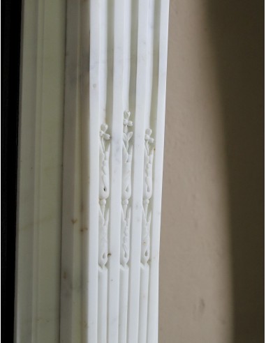Exceptionally small and refined Neoclassical “Macaron” antique fireplace mantel in pristine Statuario white marble.