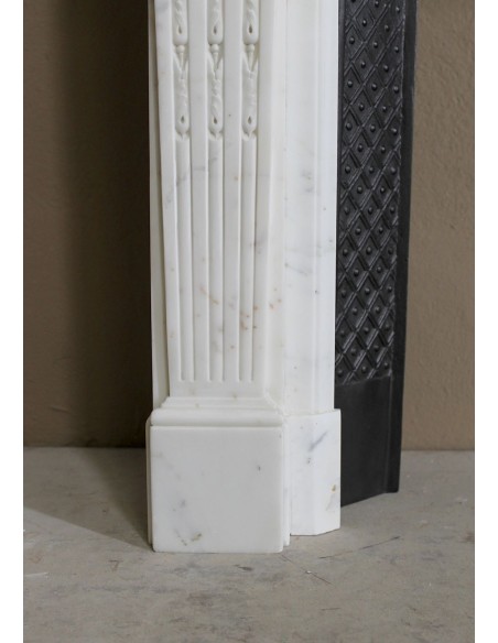 Exceptionally small and refined Neoclassical “Macaron” antique fireplace mantel in pristine Statuario white marble.