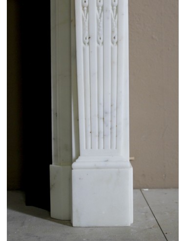 Exceptionally small and refined Neoclassical “Macaron” antique fireplace mantel in pristine Statuario white marble.