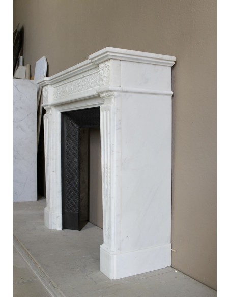 Exceptionally small and refined Neoclassical “Macaron” antique fireplace mantel in pristine Statuario white marble.