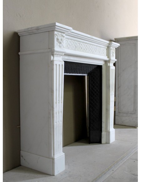 Exceptionally small and refined Neoclassical “Macaron” antique fireplace mantel in pristine Statuario white marble.