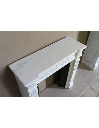 Exceptionally small and refined Neoclassical “Macaron” antique fireplace mantel in pristine Statuario white marble.