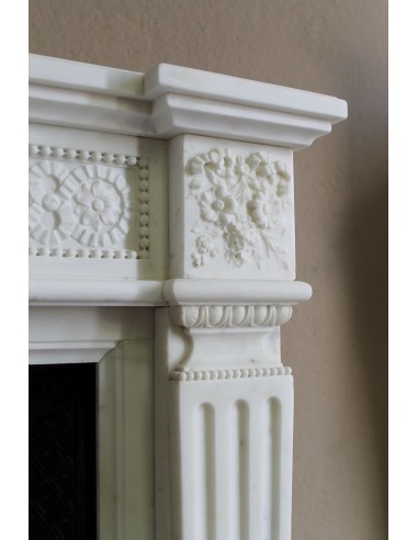 Exceptionally small and refined Neoclassical “Macaron” antique fireplace mantel in pristine Statuario white marble.