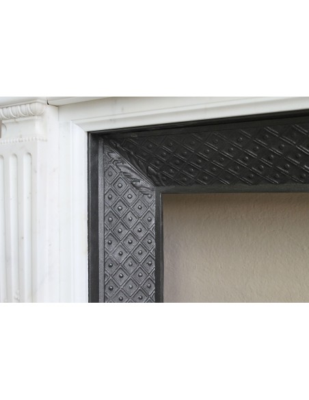 Exceptionally small and refined Neoclassical “Macaron” antique fireplace mantel in pristine Statuario white marble.