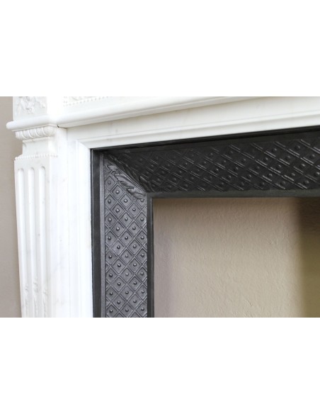 Exceptionally small and refined Neoclassical “Macaron” antique fireplace mantel in pristine Statuario white marble.
