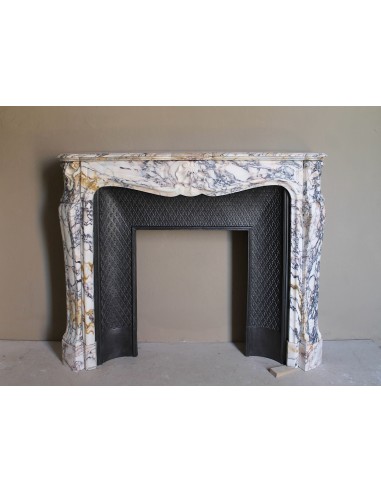 Antique Louis XV fireplace in Calacatta Gold marble with striking gold, violet and pink veining, with original cast-iron insert.