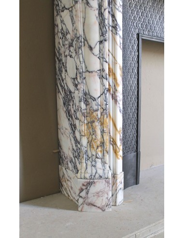 Antique Louis XV fireplace in Calacatta Gold marble with striking gold, violet and pink veining, with original cast-iron insert.