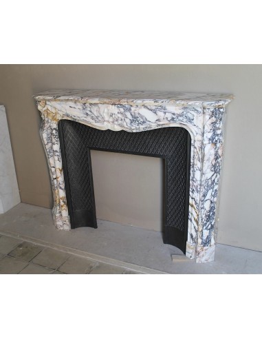 Antique Louis XV fireplace in Calacatta Gold marble with striking gold, violet and pink veining, with original cast-iron insert.