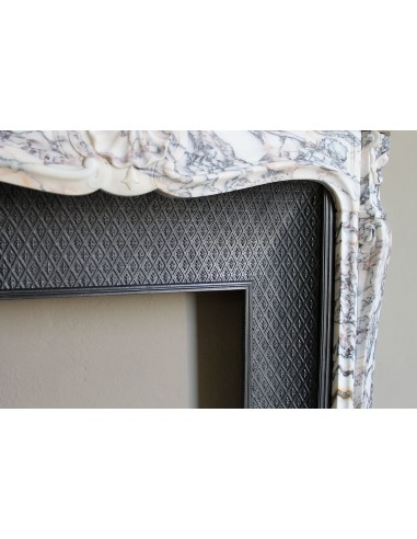 Antique Louis XV fireplace in Calacatta Gold marble with striking gold, violet and pink veining, with original cast-iron insert.