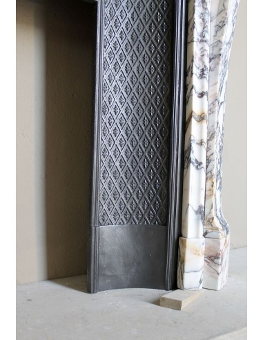 Antique Louis XV fireplace in Calacatta Gold marble with striking gold, violet and pink veining, with original cast-iron insert.