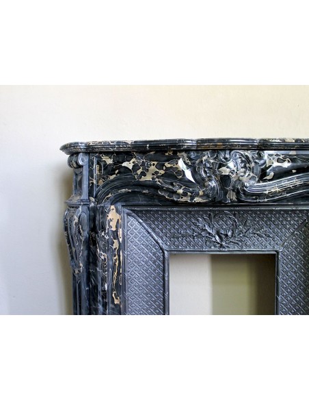 Exceptional Louis XV "Heart" antique fireplace mantel in Black Portoro Gold marble, complete with decorative cast-iron insert.