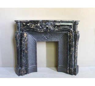 Exceptional Louis XV "Heart" antique fireplace mantel in Black Portoro Gold marble, complete with decorative cast-iron insert.