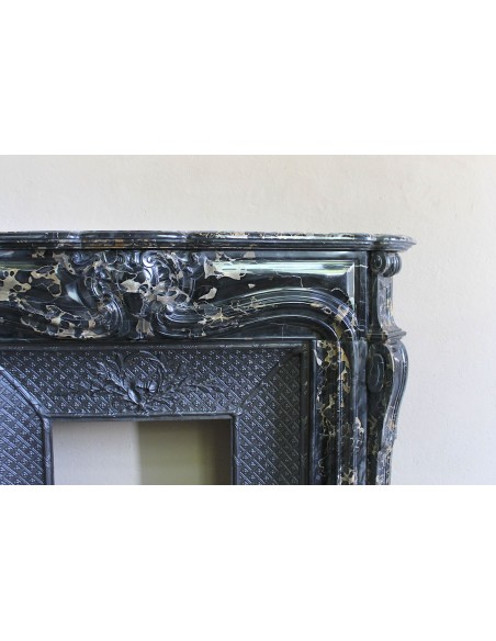 Exceptional Louis XV "Heart" antique fireplace mantel in Black Portoro Gold marble, complete with decorative cast-iron insert.