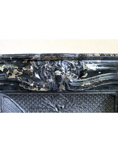 Exceptional Louis XV "Heart" antique fireplace mantel in Black Portoro Gold marble, complete with decorative cast-iron insert.