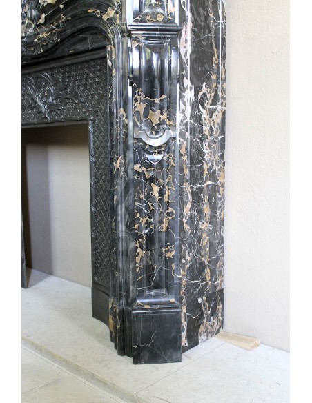 Exceptional Louis XV "Heart" antique fireplace mantel in Black Portoro Gold marble, complete with decorative cast-iron insert.