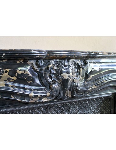 Exceptional Louis XV "Heart" antique fireplace mantel in Black Portoro Gold marble, complete with decorative cast-iron insert.