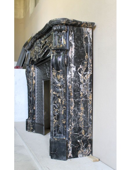 Exceptional Louis XV "Heart" antique fireplace mantel in Black Portoro Gold marble, complete with decorative cast-iron insert.