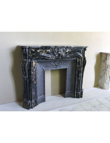 Exceptional Louis XV "Heart" antique fireplace mantel in Black Portoro Gold marble, complete with decorative cast-iron insert.